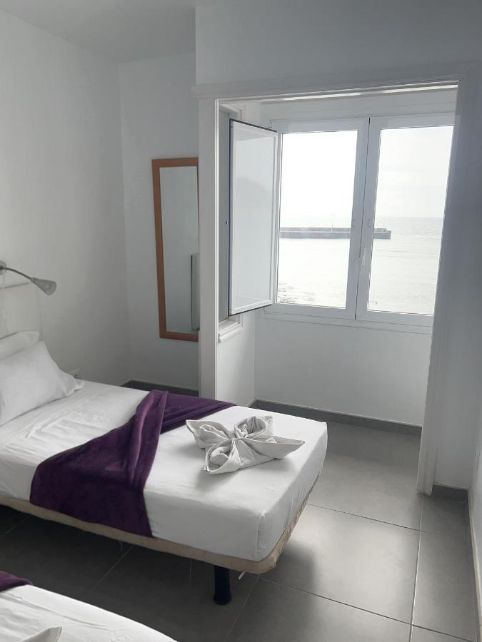 Edificio Playa Chica Apartment เอลเมดาโน ภายนอก รูปภาพ
